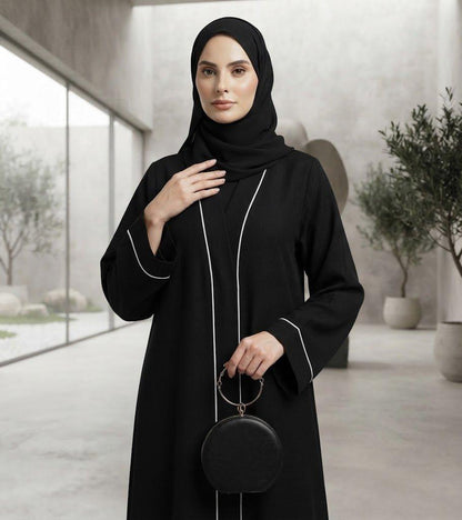 Sayarra black abaya with white piping and matching hijab by alsaadabaya