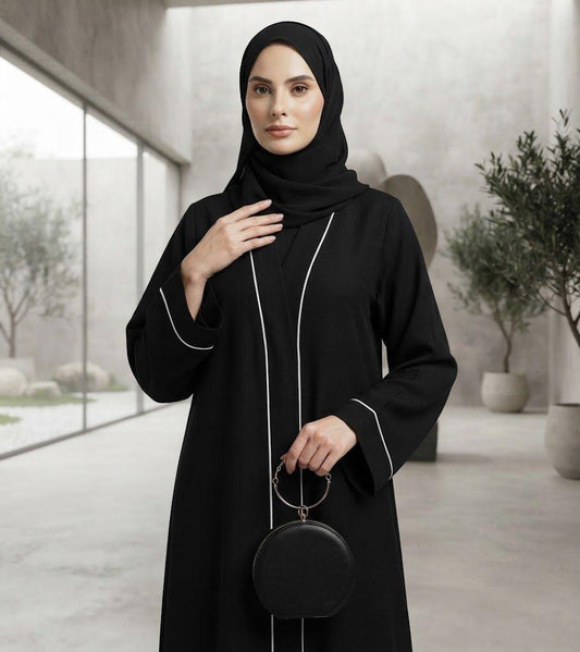 Sayarra black abaya with white piping and matching hijab by alsaadabaya