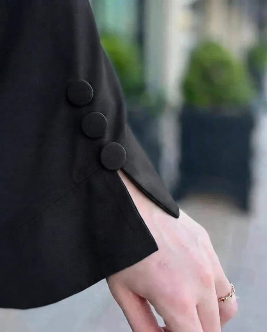 Close-up of the Ayzee Abaya-Black sleeve featuring decorative buttons and slit detail.